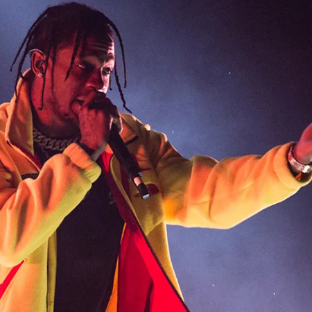 Travis Scott performing SICKO MODE on stage