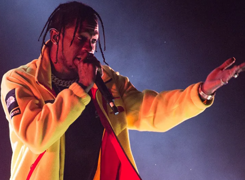 Travis Scott performing SICKO MODE on stage