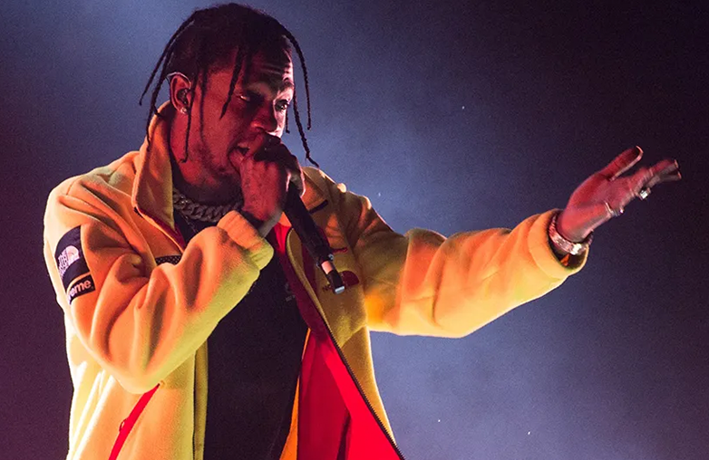 Travis Scott performing SICKO MODE on stage