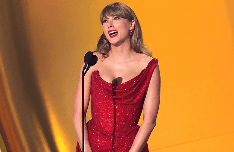 Crowd at Taylor Swift Eras Tour with stage lighting