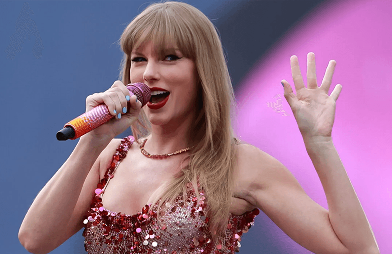 Taylor Swift performing live on stage during a stadium concert connecting with Gen Z and Millennials